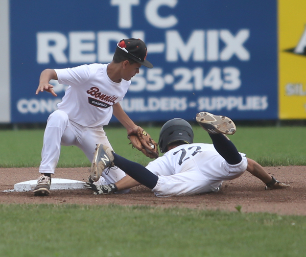 Baird Brothers pitcher Trey Pancake (22) slides into Brooklyn Bonnie Paws second baseman Samuel Urena (5) in the first inning as the Baird Brothers take on the Brooklyn Bonnie Paws in the 14u NABF World Series Championship, Sunday, July 16, 2017, at Cene Park in Struthers. Brooklyn won 2-0...(Nikos Frazier | The Vindicator)..