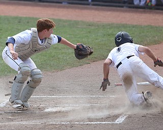 Baird Brothers catcher Connor Meyer (12) tags out Brooklyn Bonnie Paws pitcher Thomas Pallazoito (1) in the first inning as the Baird Brothers take on the Brooklyn Bonnie Paws in the 14u NABF World Series Championship, Sunday, July 16, 2017, at Cene Park in Struthers. Brooklyn won 2-0...(Nikos Frazier | The Vindicator)..