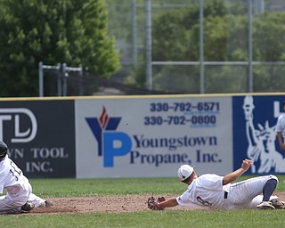 Brooklyn Bonnie Paws right fielder Tony Holden (10) slides past Baird Brothers short stop Austin Vogt (8) in the fourth inning as the Baird Brothers take on the Brooklyn Bonnie Paws in the 14u NABF World Series Championship, Sunday, July 16, 2017, at Cene Park in Struthers. Brooklyn won 2-0...(Nikos Frazier | The Vindicator)..