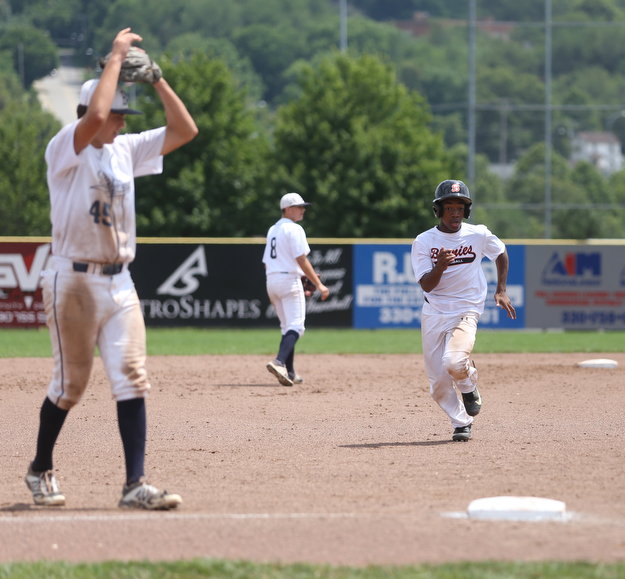 Brooklyn Bonnie Paws right fielder Tony Holden (10) sprints to third as Baird Brothers third baseman Bren Kilpatrick (45) shows frustration in the fourth inning as the Baird Brothers take on the Brooklyn Bonnie Paws in the 14u NABF World Series Championship, Sunday, July 16, 2017, at Cene Park in Struthers. Brooklyn won 2-0...(Nikos Frazier | The Vindicator)..