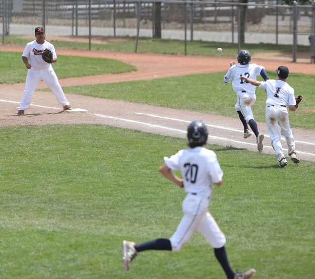 Brooklyn Bonnie Paws pitcher Thomas Pallazoito (1) fires to Brooklyn Bonnie Paws first baseman Bryan Jerez (25) to beat out Baird Brothers catcher Connor Meyer (12) as Baird Brothers center fielder Seve Cantini (20) attempts to score a run in the fifth inning as the Baird Brothers take on the Brooklyn Bonnie Paws in the 14u NABF World Series Championship, Sunday, July 16, 2017, at Cene Park in Struthers. Brooklyn won 2-0...(Nikos Frazier | The Vindicator)..