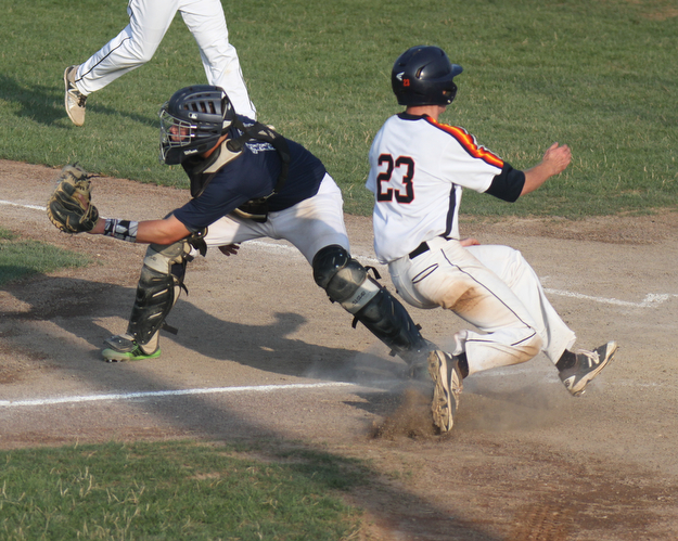 William D. Lewis The Vindicator Astro's Nick Zona(23) scores as Baird catcher Mike Turner (10) waits for the throw during  first game at Cene 7-17-17.