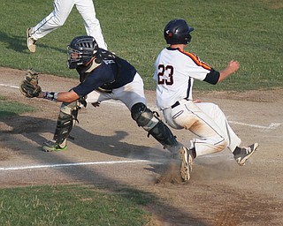 William D. Lewis The Vindicator Astro's Nick Zona(23) scores as Baird catcher Mike Turner (10) waits for the throw during  first game at Cene 7-17-17.