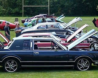 Girard Multi-Generational Center board and staff members are thanking all sponsors, volunteers, individuals and companies who helped make the Cars are the Stars 3 benefit a success. All the cars played a part in the benefit. Above are some of the classic cars that were on display. Pictured below are Christine Bridgens, program director, and Calvin Suttle, winner of the Best of Show award.