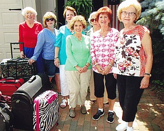 The Mignonette Garden Club recently donated luggage to various shelters for needy women. Members brought the luggage to the club’s annual picnic at the home of Beverly Muresan. Above, from left, club members are Terry Gallagher, president; Georgia D’Andrea, vice president; Dottie Bodnar, secretary; Antonia Douglass; Pat Reardon, treasurer; Victoria Nestor; and Louise Kilar.