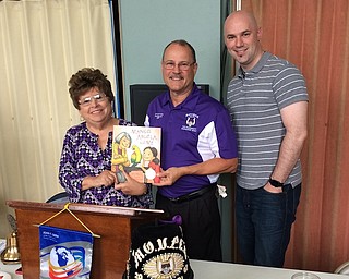 Pastor James Berkebile of the Struthers Rotary Club hosted Chuck Pompeii of the Aut Mori Grotto Clowns as speaker at a recent Rotary meeting. Pompeii discussed the history of the Aut Mori Grotto and listed many groups they support, such as cerebral palsy treatment, Muscular Dystrophy, Intellectual Disability/Down Syndrome, Organ Transplant Surgery and dental assistance for special needs community members. Pompeii, also known as “Loudmouth,” has been active in the clown unit for 30 years. For information about the Humanitarian Foundation, visit www.hfgrotto.org. Above from left are JoAnn Sweeney, Struthers Rotary president; Pompeii; and Pastor Berkebile. A book was donated in Pompeii’s name to be placed in the Struthers Elementary School Library.