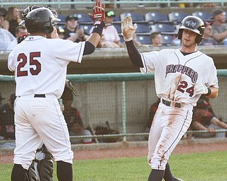 William D. Lewis the vindicator Scrappers Jonathan Laureano(25) and Ernie Clement(24) hi 5 after scoring during 7-18-17 game with Batavia.