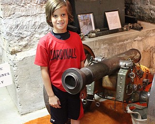 Neighbors | Abby Slanker.A Hilltop Elementary School third-grade student got an up-close look at the 1812 French cannon located in the basement of the War Vets Museum during the school’s annual Canfield History Walking Tour.