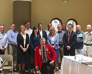 The Lions Club of Youngstown met recently for lunch in the Manchester Room of the Youngstown YMCA to install new officers and board members. Lion Parker McHenry served as toastmaster. District 13 OH4 LCIF Representative Lion Angie Tyler also presented the Melvin Jones Fellowship to Lion Pete Noll. Michael Metzinger is the new president of the club. Other officers and board members were installed by District 13 OH4 First Vice District Governor-elect Michael Tyler. Above, kneeling in front is Tyler, and standing from left are John Getchey, secretary; Noll; Diane Hardenbrook, treasurer; Adam Costello, board member; Cheri Metzinger, third vice president; Jerry Bryan and Roger Guglucello, board members; Myra Vitto, first vice president; Pete Storey, board member; Kyle Miasek, immediate past president; Metzinger; Bill Cooper, board member; and Parker McHenry. toastmaster. Not present for photo were Angie Tyler; Rick Deak, second vice president; and Stacia Erdos Littleton, Shirley Christian and Ryan Reed, board members.