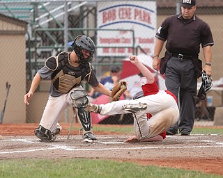 Baird catcher Coleman Stauffer (8) tags out Park Home second baseman Jake Wike (27) in the second inning as Baird Brothers take on Park Home in round 5 of the 18U NABF World Series, Saturday, July 22, 2017, at Bob Cene Park in Struthers. Park Home won 4-1...(Nikos Frazier | The Vindicator)..