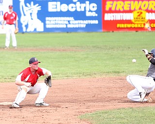 Park Home second baseman Jake Wike (27) leans down for the ball as Baird left fielder Max Harpalini (38) slides into second in the second inning as Baird Brothers take on Park Home in round 5 of the 18U NABF World Series, Saturday, July 22, 2017, at Bob Cene Park in Struthers. Park Home won 4-1...(Nikos Frazier | The Vindicator)..