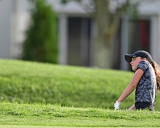 WARREN, OHIO - JULY 22, 2017: Kate Brown of Hickory watches as her ball flies toward the green after chipping out of the bunker on the 18th hole, Saturday afternoon at the Vindicator's Greatest Golfer of the Valley Jr. Championship at Avalon Lakes. DAVID DERMER | THE VINDICATOR