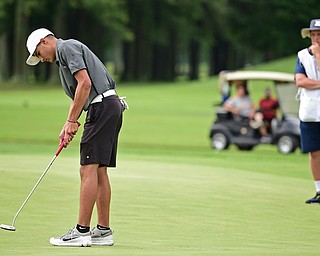 WARREN, OHIO - JULY 22, 2017: Jimmy Graham follows through on his putt while his caddie, Ryan Lee, watches from behind on the 18th hole, Saturday afternoon at the Vindicator's Greatest Golfer of the Valley Jr. Championship at Avalon Lakes. DAVID DERMER | THE VINDICATOR