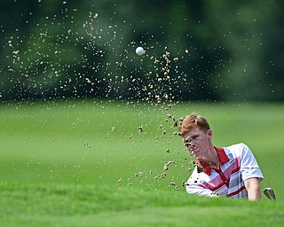 WARREN, OHIO - JULY 22, 2017: Keegan Butler chips out of the bunker on the 14th hole, Saturday afternoon at the Vindicator's Greatest Golfer of the Valley Jr. Championship at Avalon Lakes. DAVID DERMER | THE VINDICATOR