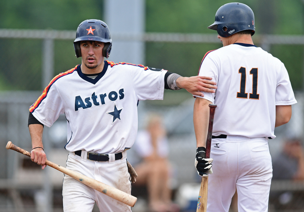 STRUTHERS, OHIO - JULY 23, 2017: Astro's Matt Gibson is con graduated by teammate Noah Laster, right, after scoring a run on a sacrifice fly by Jack Anderson in the fourth inning of their game Sunday morning against the Ohio Longhorns. Astro won 12-2. DAVID DERMER | THE VINDICATOR