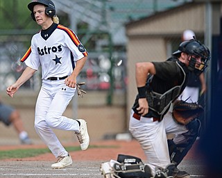 STRUTHERS, OHIO - JULY 23, 2017: Astro's Dom Pilolli scores on a double by Matt Gibson in the fifth inning of their game Sunday morning against the Ohio Longhorns. Astro won 12-2. DAVID DERMER | THE VINDICATOR ..Longhorns catcher Luke Correia pictured.