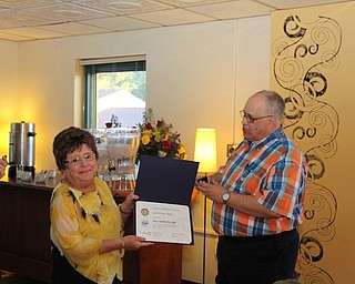 The Struthers Rotary held its annual president dinner recently at Selah’s Restaurant. Joann Sweeney and Dottie Melody received the Paul Harris Fellow award. Jessica Tirone, Struthers High School student and Interact Club president, reported on some of the activities of the club, and Cathy Miller, president of the Struthers Rotary Community Corp., spoke about their activities. The Rotary officers are, Lisa Daprile, fiscal officer; Linda Krestel, treasurer; Jennifer Johnson, president; Chuck Campbell, vice president; and Tom Baringer, executive secretary. Above, from left, Joann Sweeney, outgoing president, is presented with the Paul Harris Fellow award by master of ceremonies Tom Baringer.
