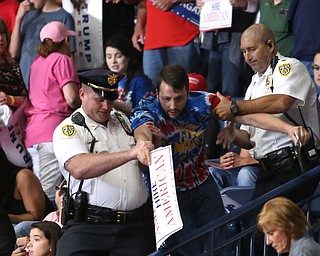 A protestor is removed as Lara Trump speaks before President Donald J. Trump at the Covelli Centre, Tuesday, July 25, 2017 in Youngstown...(Nikos Frazier | The Vindicator)