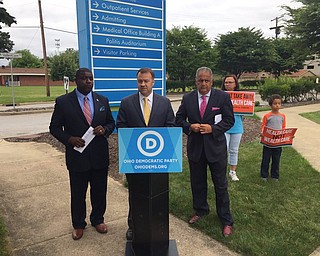 Youngstown Democratic Mayoral Candidate Jamael "Tito" Brown, Ohio Democratic Party Chairman David Pepper and Mahoning County Democratic Party Chairman David Betras outside the Northside Medical Center protesting  an expected health care vote today in the U.S. Senate.