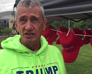 David Dickson, of Florida, selling Trump merchandise outside of Covelli Centre.