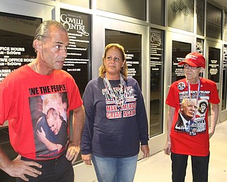 Trump supporters Gene and Cathy Huber of West Palm Beach, Fla., and Pat Morgan, right, of NYC were outside the Covelli Centre at midnight waiting for Trump Rally.