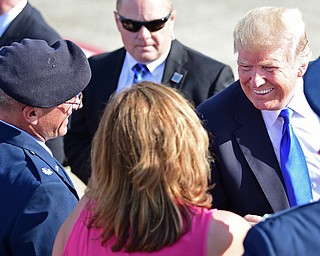 President Donald Trump smiles at the Youngstown-Warren Regional Airport, Tuesday, Tuesday, July 25, 2017, in Vienna, Ohio. Trump will be speaking at a rally Tuesday at the Covelli Centre in Youngstown, Ohio. (David Dermer/The Vindicator via AP)