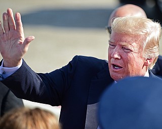 President Donald Trump waives at the Youngstown-Warren Regional Airport, Tuesday, Tuesday, July 25, 2017, in Vienna, Ohio. Trump will be speaking at a rally Tuesday at the Covelli Centre in Youngstown, Ohio. (David Dermer/The Vindicator via AP)