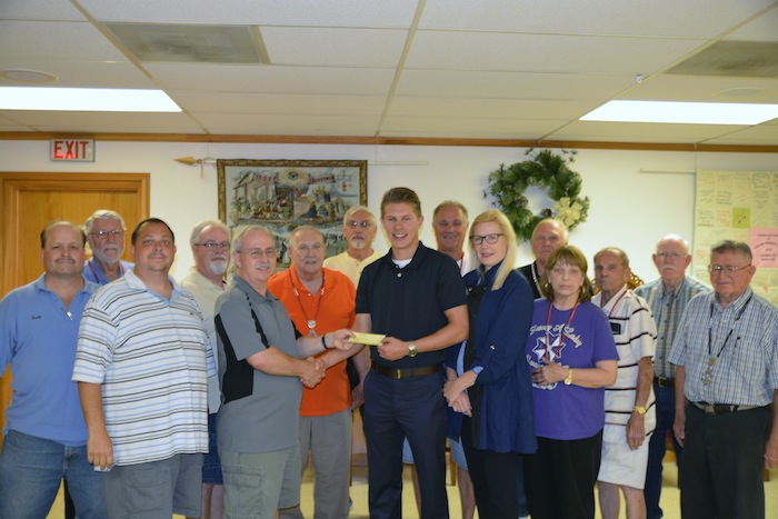 Canfield (I.O.O.F.) Independent Order of Odd Fellows Lodge 155 presented a scholarship check to Benjamin Targove, a graduate of Canfield High School. Targove will attend the University of Akron this fall, where he will major in nursing. Above, from left are, Frank Schill, Jack Barton, Dan Roberts, Bill Thompson, Noble Grand Al Thompson, Sparky Ashby, Dave Habeger, Targove, Don Habeger, Kayte Targove, Rich Eberth, Donna Faiola, George Makar, Gary Kerns and Lloyd Schooley.