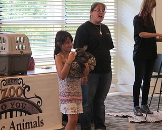 Neighbors | Alexis Bartolomucci.One of the children had the opportunity to feed a wallaby with a bottle at the end of the Our Zoo to You program at the Austintown library.