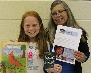 Neighbors | Abby Slanker.Hilltop Elementary School fourth-grade student Karley Gerst (left) was named an honorable mention winner in the “Ohio Schools” magazine annual Create a Cover Contest with the help of Hilltop Elementary School Physical Education teacher Linda Magyar (right) who sent in Gerst’s drawing to the contest.