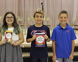 Neighbors | Abby Slanker.Hilltop Elementary School fourth-grade student Travis Mills (center) was crowned champion of the school’s annual Fourth-Grade Spelling Bee, with Angelea Latone (left) named second place winner and with Nick Bernardino (right) named third place winner.
