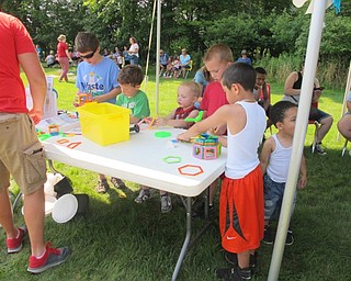 Neighbors | Alexis Bartolomucci.Children at the Boardman library on July 19 made crafts while they waited for their turn to ride the ponies.