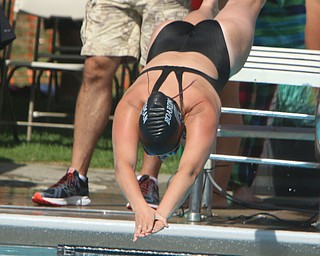 Mackenzie Widrig of the Boardman Tennis and Swim Club jumps off her block to start the girls 15-18 50 meter freestyle during the Youngstown Swim League championships at the Poland Swim club in Poland on Saturday morning.  Dustin Livesay  |  The Vindicator  7/29/17  Poland.
