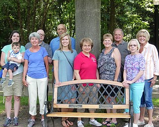 The Boardman Lions Club has added a plaque to a bench it placed in Boardman Park in honor of longtime member Bud Jenkins, who died in 2015. The plaque is in memory of Jenkins’ daughter, Bonnie Koch, who died unexpectedly a year later. Both Jenkins and Koch had requested that memorial tributes go to the club’s Target New Coats for Kids project. The club has conducted the coat project since 2009 and has purchased 733 coats over the years. Above, first row from left, are club members Jaclyn Rausch holding her son Jameson, Judy Jones, Jana Coffin, Marlene Strollo, Betsy Koch and Nancy Golubic. In the back row, from left, are Bill Rausch, Todd Werth, Henry Koch and Kathy Collins.