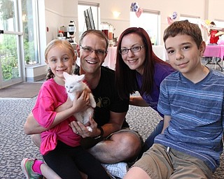 Neighbors | Abby Slanker.Brynna Jones and her family, Dustin, Lindsay and Bastein, celebrated Brynna’s $1,000 donation to Angels for Animals during the organization’s Cats, Cupcakes and Coffee open house and bake sale on June 3.