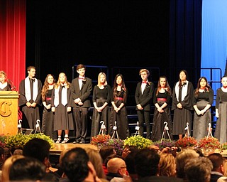 Neighbors | Abby Slanker.Canfield High School Choir Director Kelly Scurich (left) recognized senior choir members at the school’s annual spring concert on May 25.