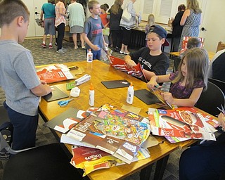 Neighbors | Alexis Bartolomucci.Children worked on created Pop Art at the Austintown library using techniques that artist Michael Albert taught them.
