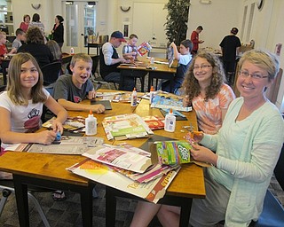 Neighbors | Alexis Bartolomucci.One of the families at the Pop Art with Michael Albert program used different boxes to create their own art.