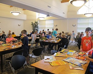 Neighbors | Alexis Bartolomucci.The Austintown library was filled with children and their families to meet artist Michael Albert and create their own pop art.