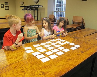 Neighbors | Alexis Bartolomucci.Children worked together to solve a Spanish numbers memory game for the Spanish for Bigger Kids Poland library program.