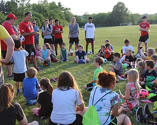 Neighbors | Abby Slanker.Canfield High School boys and girls soccer Coach Phil Simone (left) drew names for prizes during the annual Soccer Kids Camp for Canfield Soccer Club recreational league players on June 13.