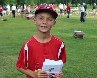 Neighbors | Abby Slanker.Even the youngest Cardinals, including third-grader Danny Chaplow representing volleyball and baseball, volunteered at the Till Open Golf Scramble on July 1.