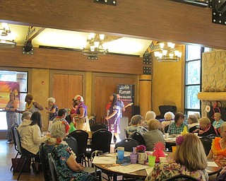 Neighbors | Alexis Bartolomucci.Guests at the senior day luau event on July 27 watched as their friends danced to music.