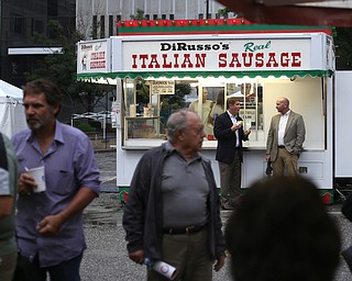 Rep. John Boccieri enjoys a DiRusso's sandwich during the Greater Youngstown Italian Festival, Friday, August 4, 2017 in Downtown Youngstown...(Nikos Frazier | The Vindicator)