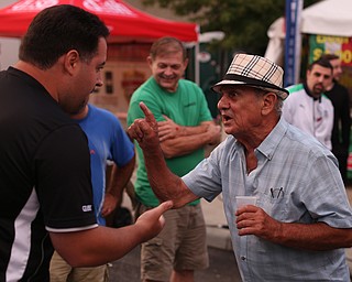 Frank Corso of Youngstown(right) plays Mora during the Greater Youngstown Italian Festival, Friday, August 4, 2017 in Downtown Youngstown...(Nikos Frazier | The Vindicator)