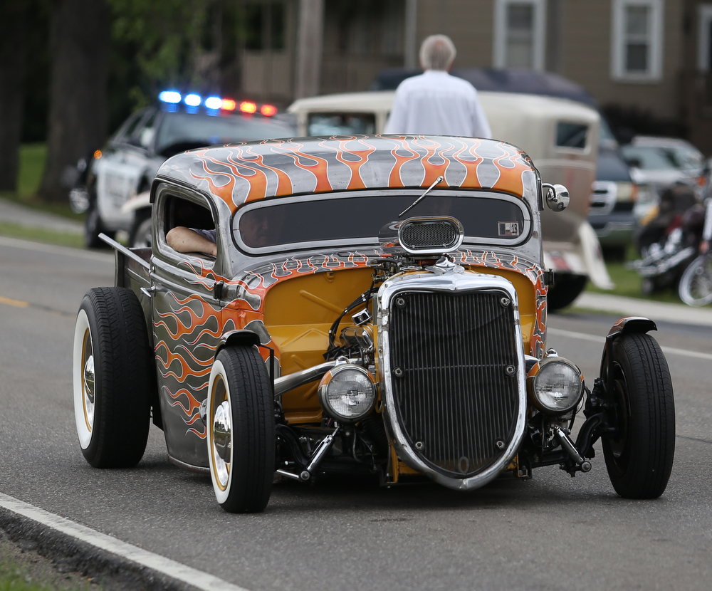 A hot rod drives down N. River Road during the 5th Annual Wings and Wheels, Sunday, August 6, 2017 at Ernie Hall Aviation Museum in Warren...(Nikos Frazier | The Vindicator)