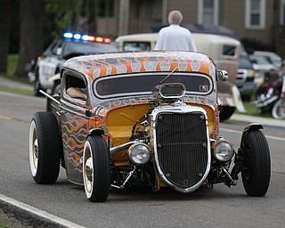 A hot rod drives down N. River Road during the 5th Annual Wings and Wheels, Sunday, August 6, 2017 at Ernie Hall Aviation Museum in Warren...(Nikos Frazier | The Vindicator)