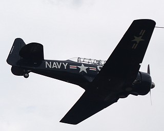 A plane flies during the 5th Annual Wings and Wheels, Sunday, August 6, 2017 at Ernie Hall Aviation Museum in Warren...(Nikos Frazier | The Vindicator)