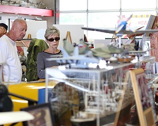 Bob Johnson of Warren and Eunie McAllister of Cortland look over an exhibit during the 5th Annual Wings and Wheels, Sunday, August 6, 2017 at Ernie Hall Aviation Museum in Warren...(Nikos Frazier | The Vindicator)