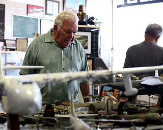 Jack Kape of Bristolville looks over an exhibit during the 5th Annual Wings and Wheels, Sunday, August 6, 2017 at Ernie Hall Aviation Museum in Warren...(Nikos Frazier | The Vindicator)